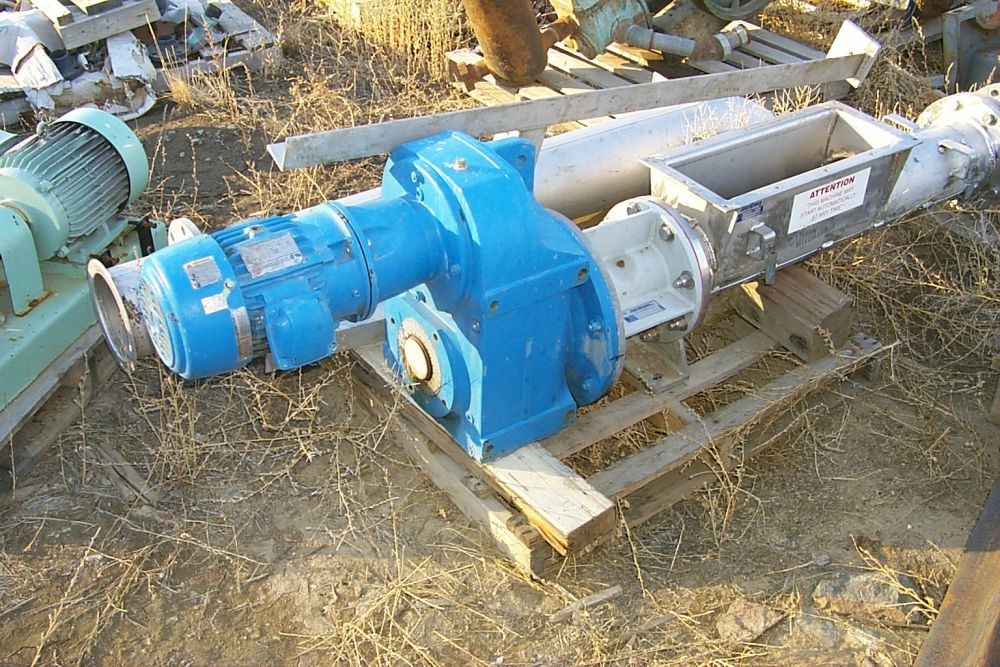 John Meunier 7 in. dia. x 4 ft long rotary screw compactor.  With 156.3-1 ratio Eurodrive gear reducer.  3 HP, 575 volt.