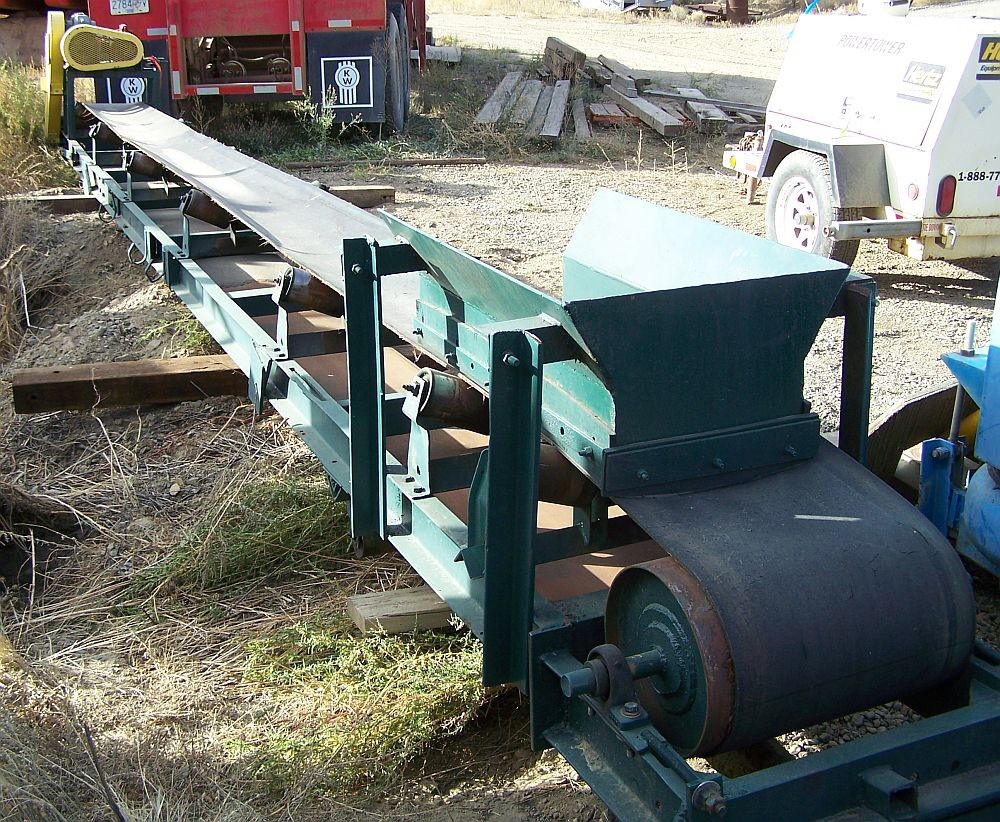 Used Channel Conveyor. 18 in. x 30 ft. Long. 2 HP Single Phase Electric Motor.