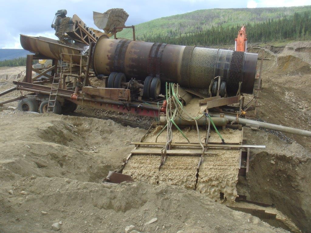 60 inch dia. X 35 foot long trommel. 30hp electric drive. Complete with sluice box.