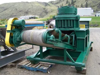 Symons 18 inch cone crusher. On skid frame complete with electric motor, lubrication system and complete electrical control panel. Under discharge conveyor. Refurbished and ready for work.